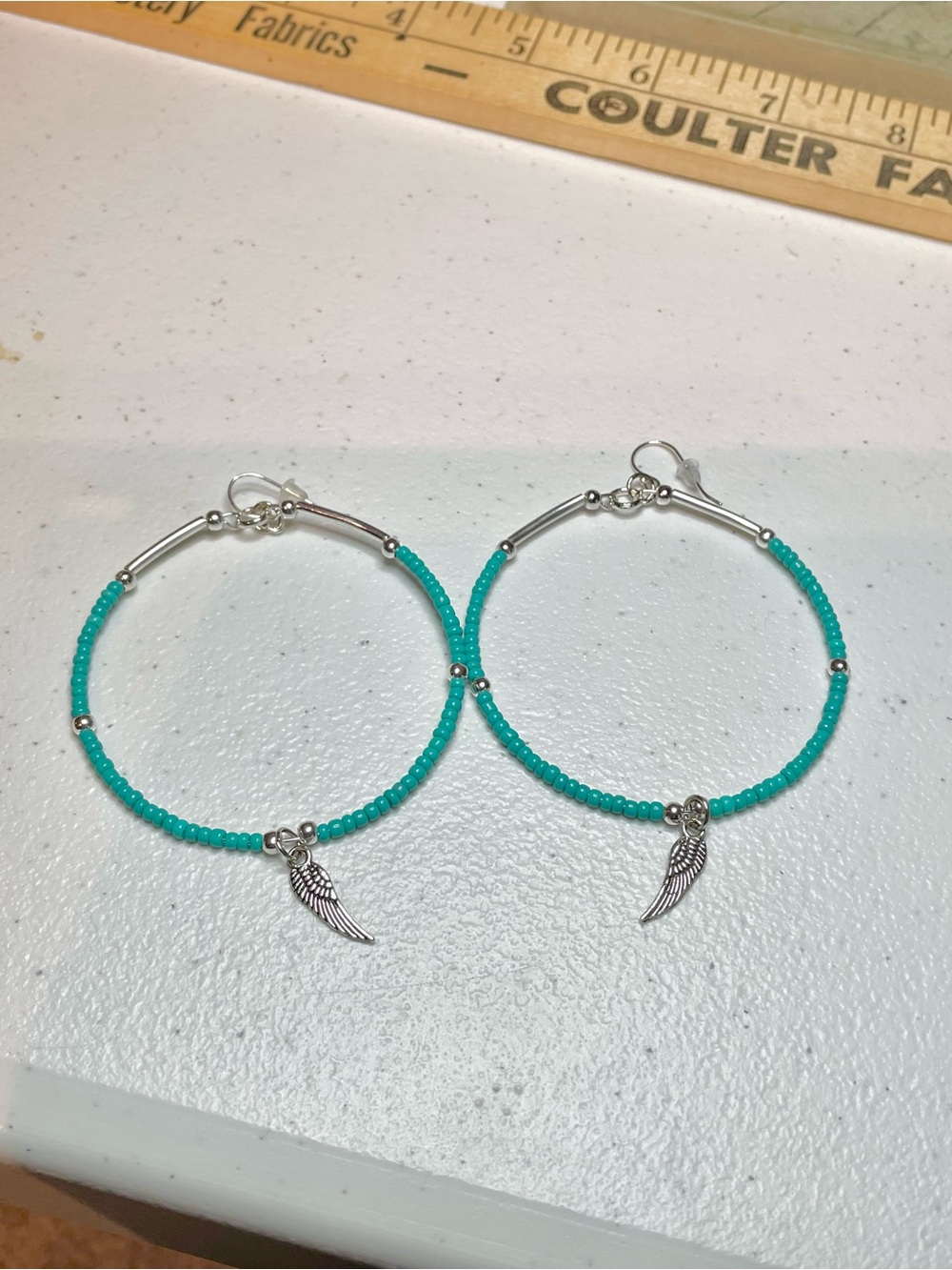 Turquoise Beaded Hoop Earrings with Silver Wing Charms